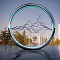 Modern Circular Sculpture With Mountain Line Design Blue Light Ring Urban Background Water Reflection
