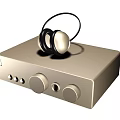 Gold Colored Headphones Placed On Classic Audio Device With Control Knobs And Sleek Design