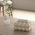 Wooden Table With White Ball Shaped Decor Green Plant In Glass Vase And Card Holder