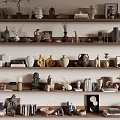 Artistic Decorative Ornament Combinations On Multiple Shelves With Vases Sculptures Books And Decor Items