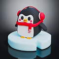 Cute Penguin Figurine Wearing Red Headphones And Red Scarf On Blue Ice Block