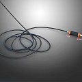 Black Coiled Cable With Orange And Silver Plug On Gray Background 3d model
