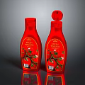 Two Red Premium Bottles With Fresh Pomegranate Label And Flower Design Accents