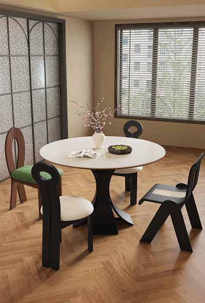 Round White Dining Table Set with Mixed Design Chairs Green White Cushions Vase and Book 3d model
