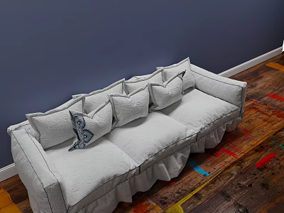 Light Gray Three Seater Sofa with Decorative Pillows and Ruched Edges Against Dark Blue Wall 3d model
