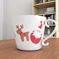 White Christmas Mug With Reindeer And Santa Claus Designs On Wooden Table