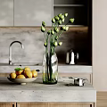 Decorative Accessories Set With Green Bud Vase Lemon Bowl And Silver Cup On Kitchen Countertop