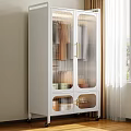 White Cabinet With Glass Doors And Golden Handles Holding Kitchenware Near Window Curtains