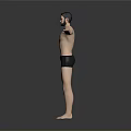 Fit Shirtless Man Standing With Arms Outstretched In Black Shorts Against Gray Background