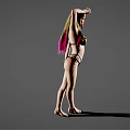 Woman in Black and Yellow Bikini Posing with One Hand on Head Against Grey Background