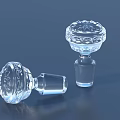 Two Decorative Transparent Glass Stoppers With Intricate Patterns For Home Decor