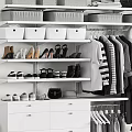 Organized Wardrobe With Gray And White Storage Boxes Various Shoes Hanging Garments And Drawers