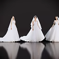 Three Women In White Wedding Dresses Standing Against Black Background With Floor Reflections