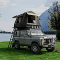 Scenic Mountain Lake View With Off Road Vehicle And Roof Tent On Green Meadow