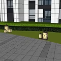 Square Outdoor Lights Illuminating Modern Building Lawn With Stone Pavement And Bushes
