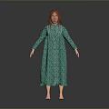 Woman In Green Long Dress With White Trim Standing Barefoot Against Gray Background