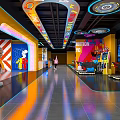 Colorful Indoor Play Zone With Bright Neon Lights And Cartoon Character Decorations