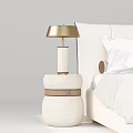 Beige Fabric Bedside Table With Gold Lamp Next To White Bed 3d model