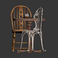 Round Wooden Table With Two Chairs One Wooden And One Ornate Metal With Plates