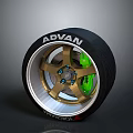 Car Wheel With ADVAN Brand Golden Rim And Green Brake Caliper Design