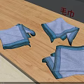 Soft Light Blue Towels With Striped Edges Folded On Wooden Table