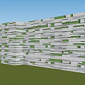 Modern Landscape Feature Wall With Striped Stone Slats Green Plants Surrounded By Grass And Trees