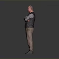Man Standing with Arms Crossed in Black Vest Gray Shirt Brown Pants Gray Gradient Background