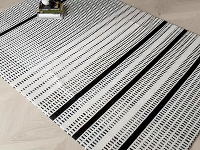 Stylish Black And White Striped Square Rug With Geometric Pattern On Wooden Floor 3d model