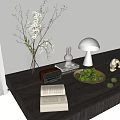 Stylish Decorative Ornament Set With Open Book Vase Rabbit Lamp And Limes On Wooden Table