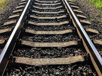 Straight Railway Tracks With Wooden Sleepers Gravel And Grass Edges 3d model