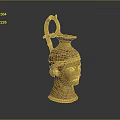 Intricate Golden Head Sculpture With Carved Facial Features Handle And Spout