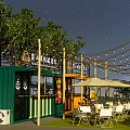 Container Building Outdoor Cafe Dining Area With Seating Tan Umbrella String Lights And Trees 3d model