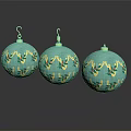 Three Turquoise Christmas Ornaments With Gold Leaf Patterns And Shiny Reflections