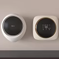 Two Modern Wall Mounted White Washing Machines With Black Panels And Digital