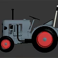 Blue Toy Tractor With Red Wheels Black Seat And White Handlebars