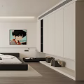 Modern Bedroom Interior With Black Bed White Cabinets Portrait Artwork And Natural Light
