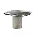 Modern Coffee Table Featuring Glass Top And Distressed Metal Pedestal With Unique Design