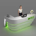 Modern Reception Desk With Green Accent Laptop Flower Bouquet Company Logo And Staff Member