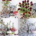 Elegant Wine Bottles and Wine Glasses with Red Roses Cherries and Ice Bucket