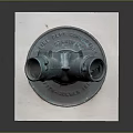 Rusted Copper Vintage Weapon Connection Port With White Square Base And Shut Off Label