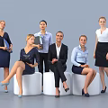 Group of Professional Women in Office Attire Standing and Sitting With Documents and Coffee Cups