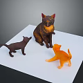 Three Cat Models in Different Colors Standing on White Board Surface