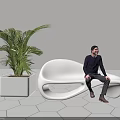 Modern Sleek White Public Chair with Large Green Plant and Man Sitting on Hexagonal Tiles