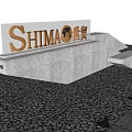 Feature Wall With SHIMA Logo Golden Letters Gray Stone Structure And Gravel Ground