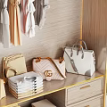 Organized Bedroom Wardrobe Interior With Hanging Clothes Folded Clothing And Designer Bags