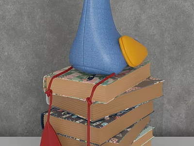 Stylish Decorative Ornament Set With Stacked Books Red String And Blue Yellow Accents 3d model