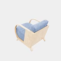 Blue Velvet Armchair With Curved Wooden Armrests And Light Wooden Floor
