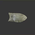 Ancient Handcrafted Stone Wood Spearhead Tool With Handwritten Label And Natural Texture