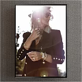 Stylish Blonde Woman In Dark Blazer With Gold Buttons Sunglasses And Accessories Under Sunlight Flare