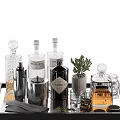 Modern Black Bar Cart Decor Setup With Wine Bottles Metal Containers Green Plant And Glasses